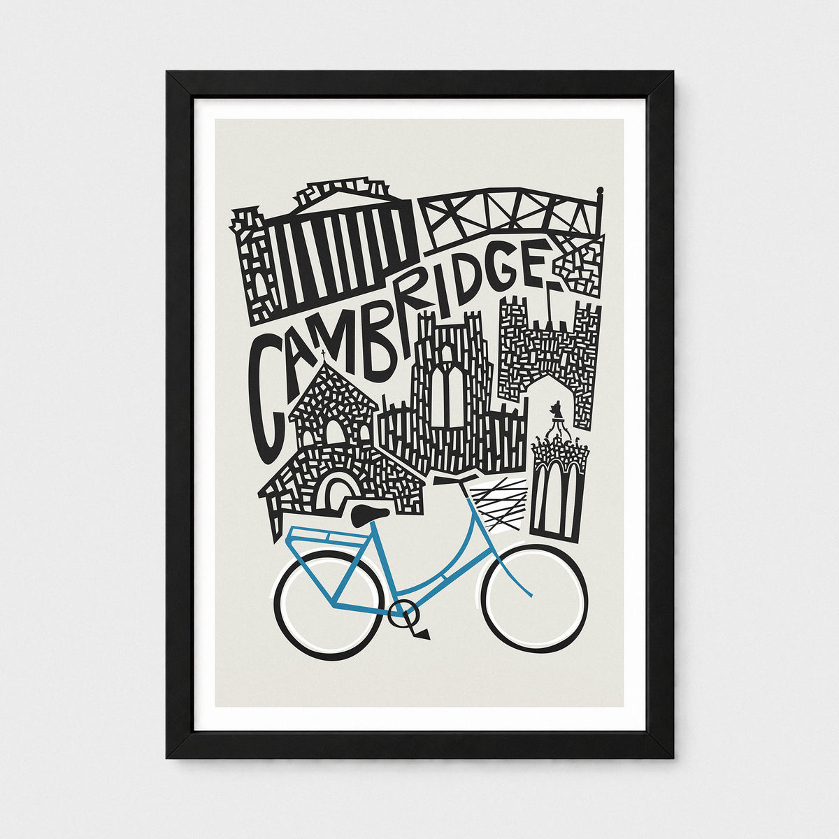 A framed art print featuring a hand-drawn black ink illustration of Cambridge landmarks and a bright blue bicycle on a light beige background, presented in a black frame with a white mat.
