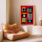 Modern interior with a brown leather chair and colorful abstract art on the wall.