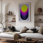 Modern living room with a gray sofa, colorful abstract art, and wooden coffee table.