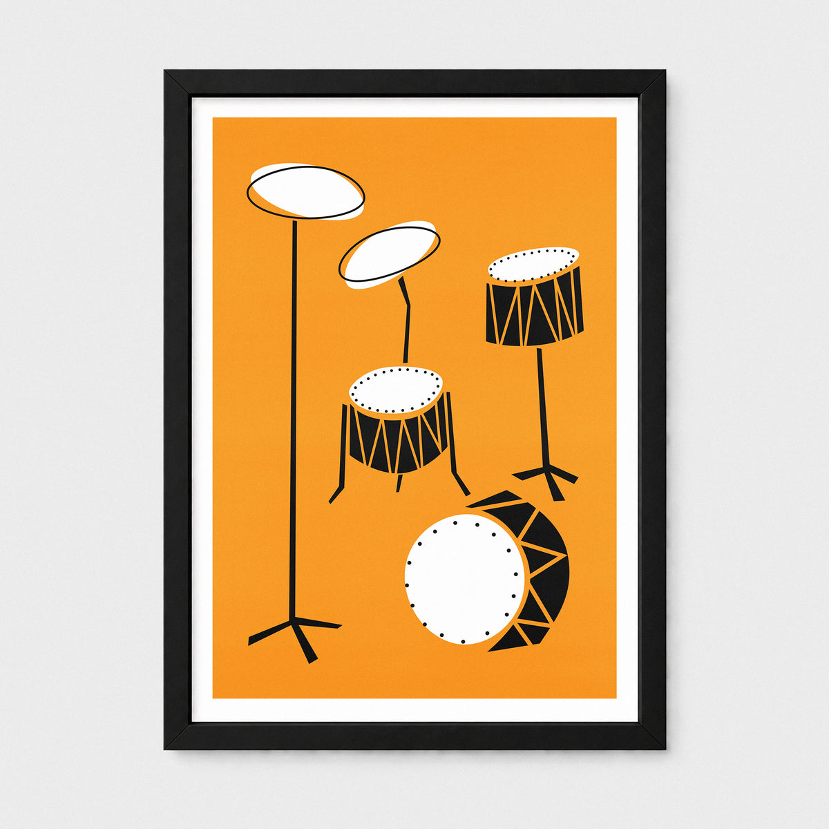 A framed minimalist art print featuring a drum set illustration in black, white, and orange, displayed on a light gray background.