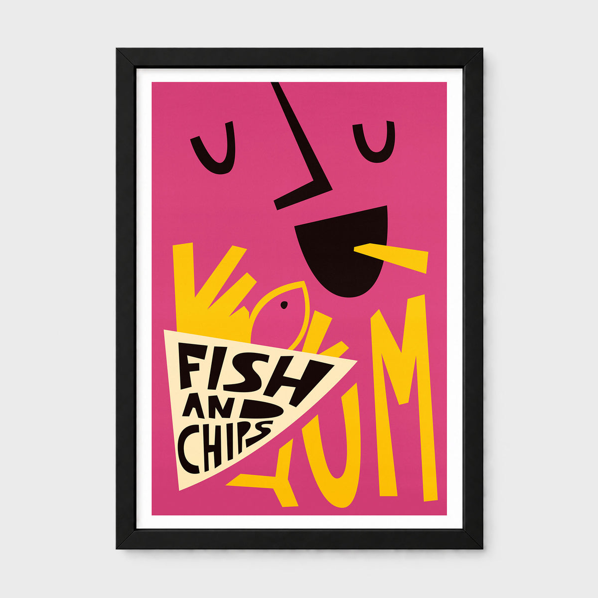 A framed graphic art print featuring a stylized face with yellow eyes, a yellow mouth, and a fish-shaped chip bag labeled 'FISH AND CHIPS' on a bright pink background, shown against a light gray wall.