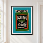A framed art print featuring a stylized pickle jar labeled 'PICKLED GHERKINS' on a turquoise background, hung on a white wall next to a window.