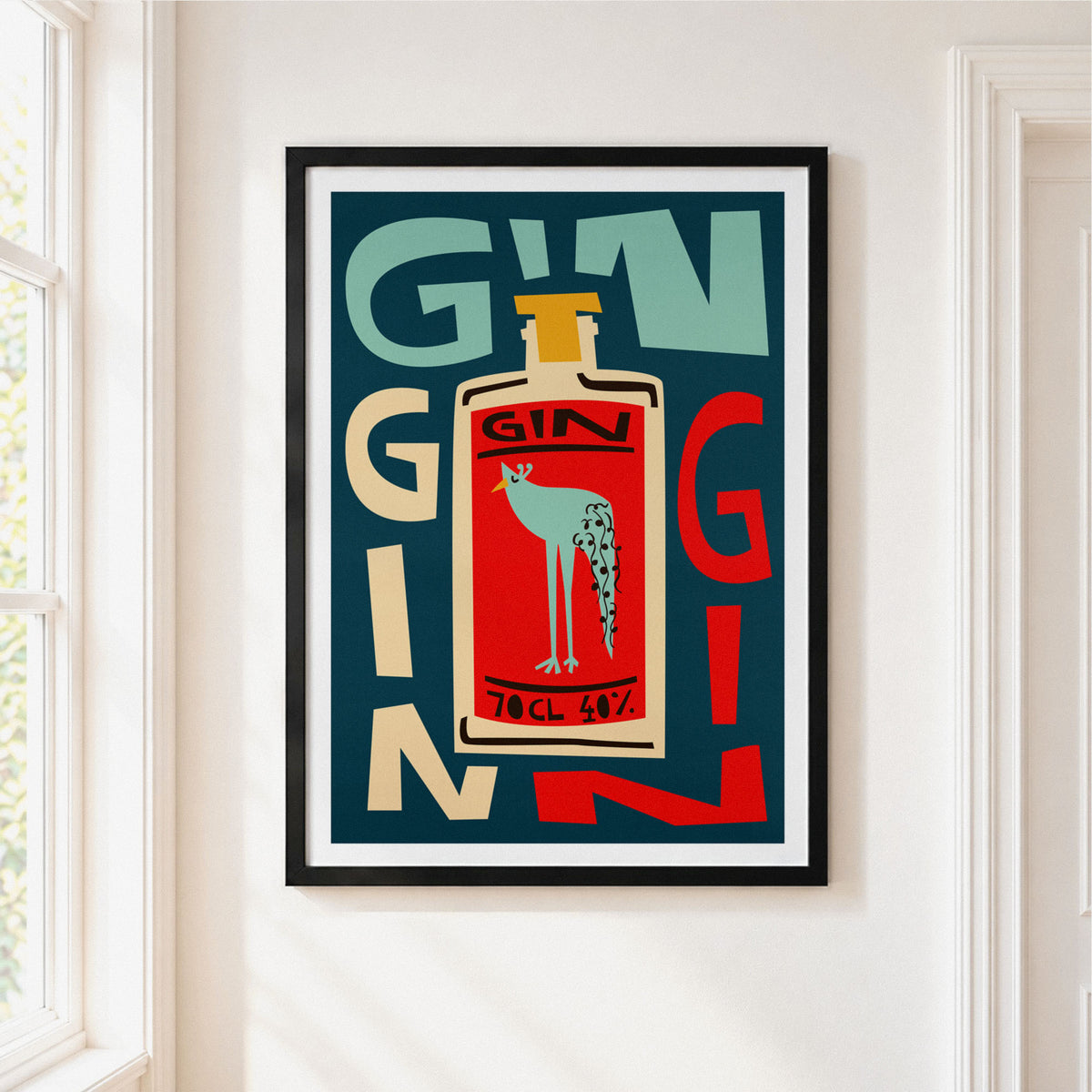 A framed art print featuring a retro-style illustration of a gin bottle with a bird on the label, mounted on a white wall next to a window.