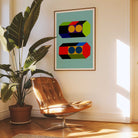 Modern interior with a brown leather chair, potted plant, and abstract art on the wall.