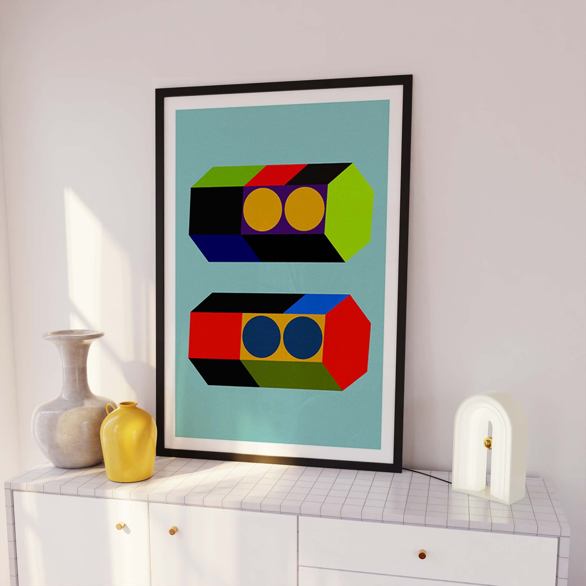 Framed abstract art print on a white wall with decorative vases below.