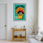 A framed art print featuring a minimalist black grand piano silhouette on a mustard yellow background, displayed on a white wall in a modern living room setting above a gold bar cart.