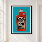 A framed art print featuring a stylized red maple syrup bottle on a bright teal background, hung on a white wall next to a window.