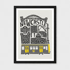 A framed art print featuring a stylized black and white illustration of Newcastle with a yellow tram, shown against a light gray background.