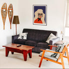 a portrait of the singer Debby Harry in a block frame in a living room