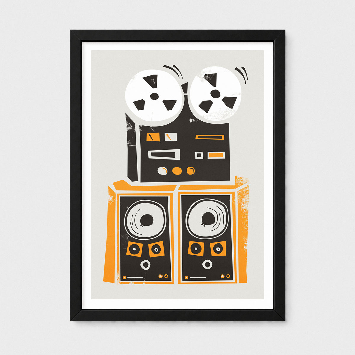 Framed wall art featuring a stylized illustration of a reel-to-reel tape recorder and two speakers in black, orange, white, and gray on a light gray background.