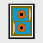 A framed abstract geometric art print featuring two blue rectangles, orange rotated squares, olive green circles, and pink vertical ovals, presented in a black frame against a light gray background.