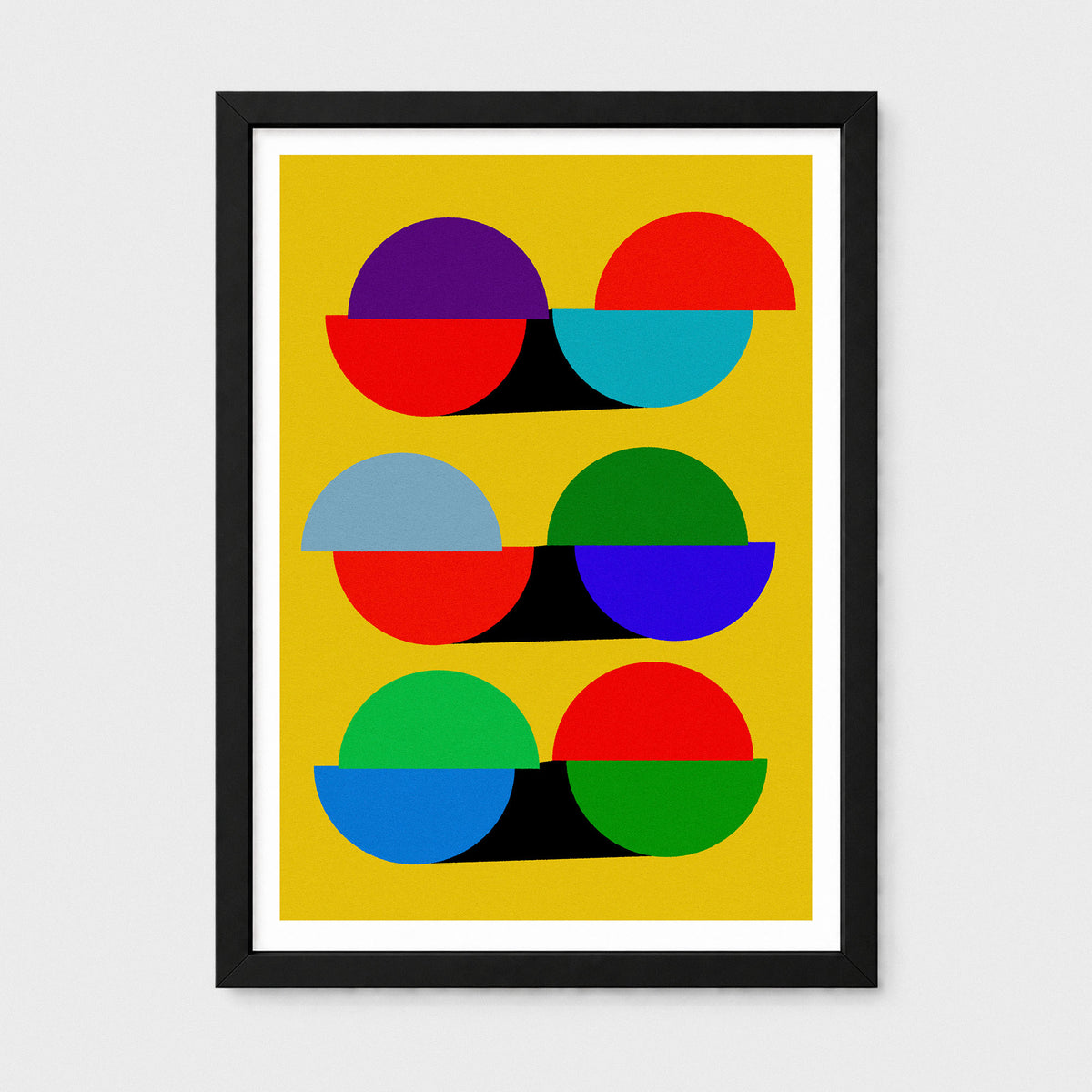 A framed abstract art print featuring a retro mid-century modern design with overlapping semicircles in red, purple, blue, green, and light blue on a mustard yellow background, enclosed in a black frame with a white mat.