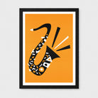 Framed minimalist art print featuring a stylized saxophone made of black, white, and orange geometric shapes on an orange background, set in a black frame with a white mat.