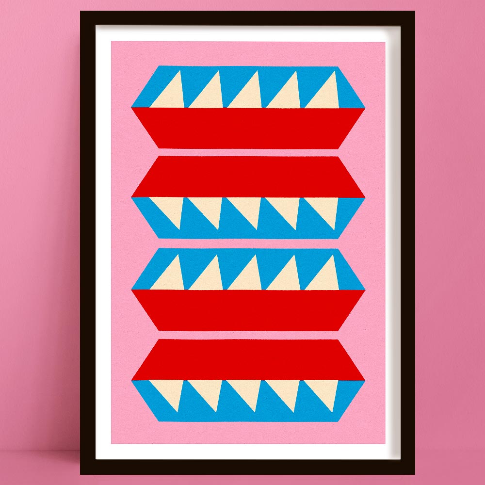 Framed geometric art print with red, blue, and beige shapes on a pink background