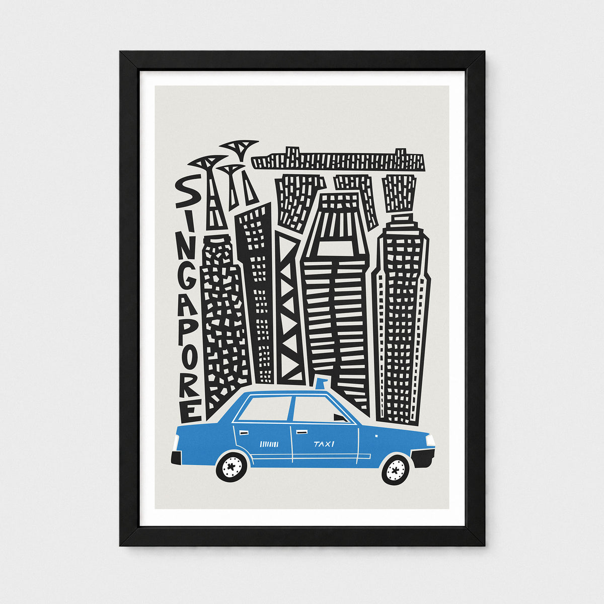 A framed art print featuring a stylized illustration of Singapore's skyline with the word 'SINGAPORE' written vertically, alongside a blue taxi at the bottom. The print has a light gray background, is mounted with a white mat, and is enclosed in a black frame, shown against a light gray wall.
