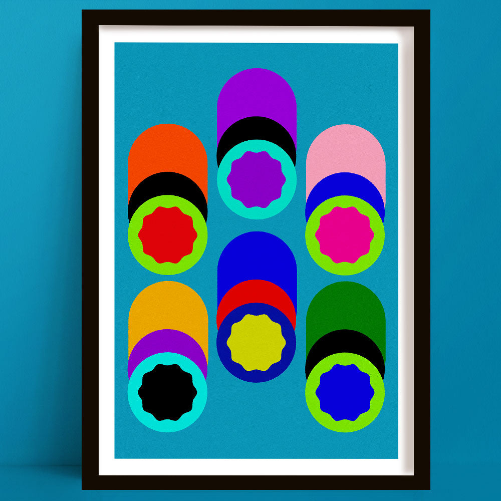 Framed abstract art print with colorful geometric shapes on a blue background