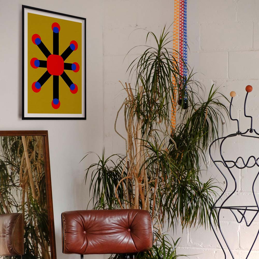 Modern interior with abstract art, plants, and a brown leather chair.