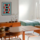 Dining area with wooden table and chairs, sideboard, and abstract art on the wall.