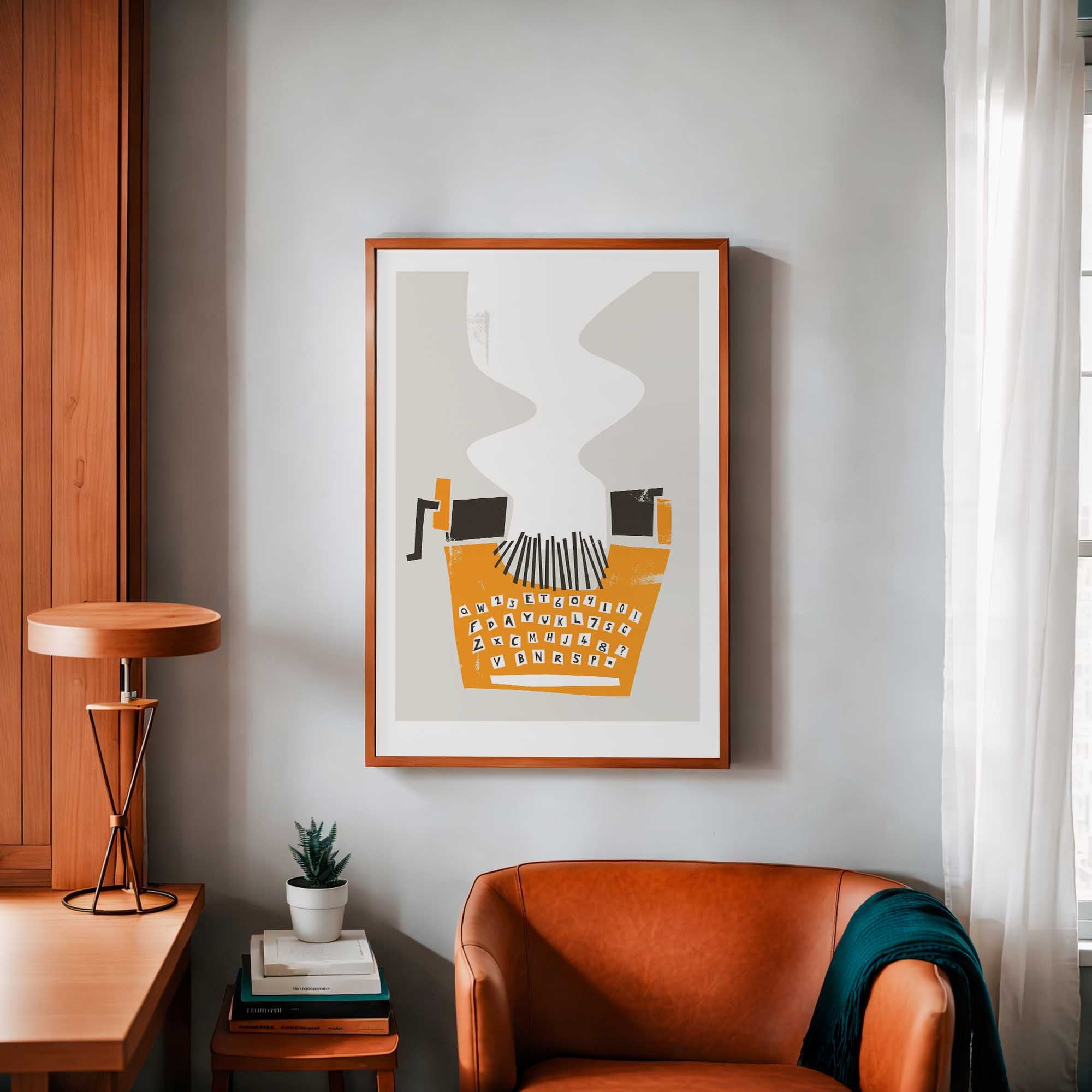 Modern interior with a framed Typewriter art print on the wall, brown leather chair, and wooden desk.