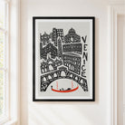 A framed art print featuring a black and white hand-drawn illustration of Venice with a small red gondola, hanging on a light beige wall next to a window.