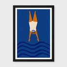 A framed minimalist art print depicting a wild swimming diver upside down in mid-air above stylized blue waves. The print features a solid dark blue background, an orange and cream diver, and is housed in a black frame with a white mat, set against a light gray background.