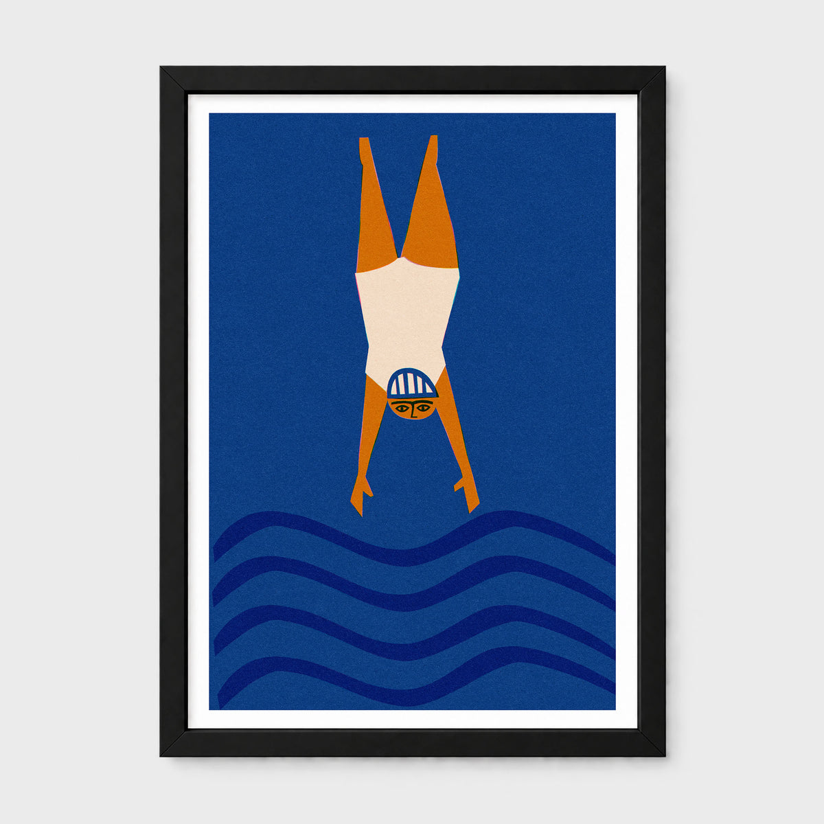 A framed minimalist art print depicting a wild swimming diver upside down in mid-air above stylized blue waves. The print features a solid dark blue background, an orange and cream diver, and is housed in a black frame with a white mat, set against a light gray background.