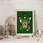 Absinthe artwork styled on a stone wall shelf with cocktail glasses and barware.
