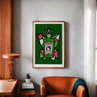 Absinthe poster framed above a rust armchair in a warm, modern living space with wood accents.