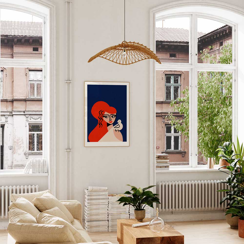 The Aphrodite print displayed in a sunlit living room, its striking red hair and peaceful expression adding warmth and elegance to the interior.
