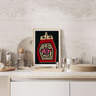 BBQ Sauce print framed on a stone-textured kitchen shelf styled with bar tools and glasses.