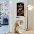BBQ Sauce poster framed on a clean white wall near a modern lamp and pastel hallway.
