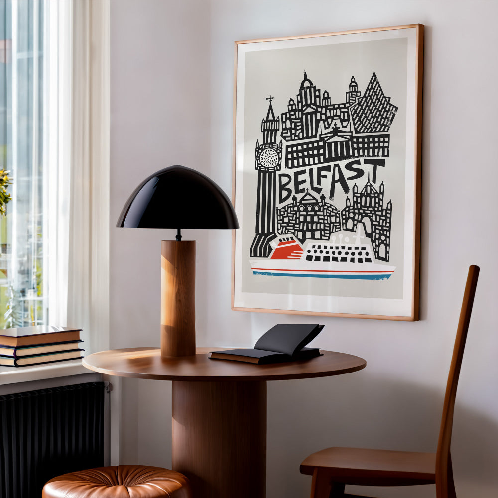 The Belfast city art print styled in a cosy corner studio, its dynamic composition and monochrome skyline energising the space with urban flair.