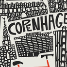 A black and white graphic illustration featuring stylized city buildings and the word 'COPENHAGEN' in large bold letters, with a small red accent near the bottom.