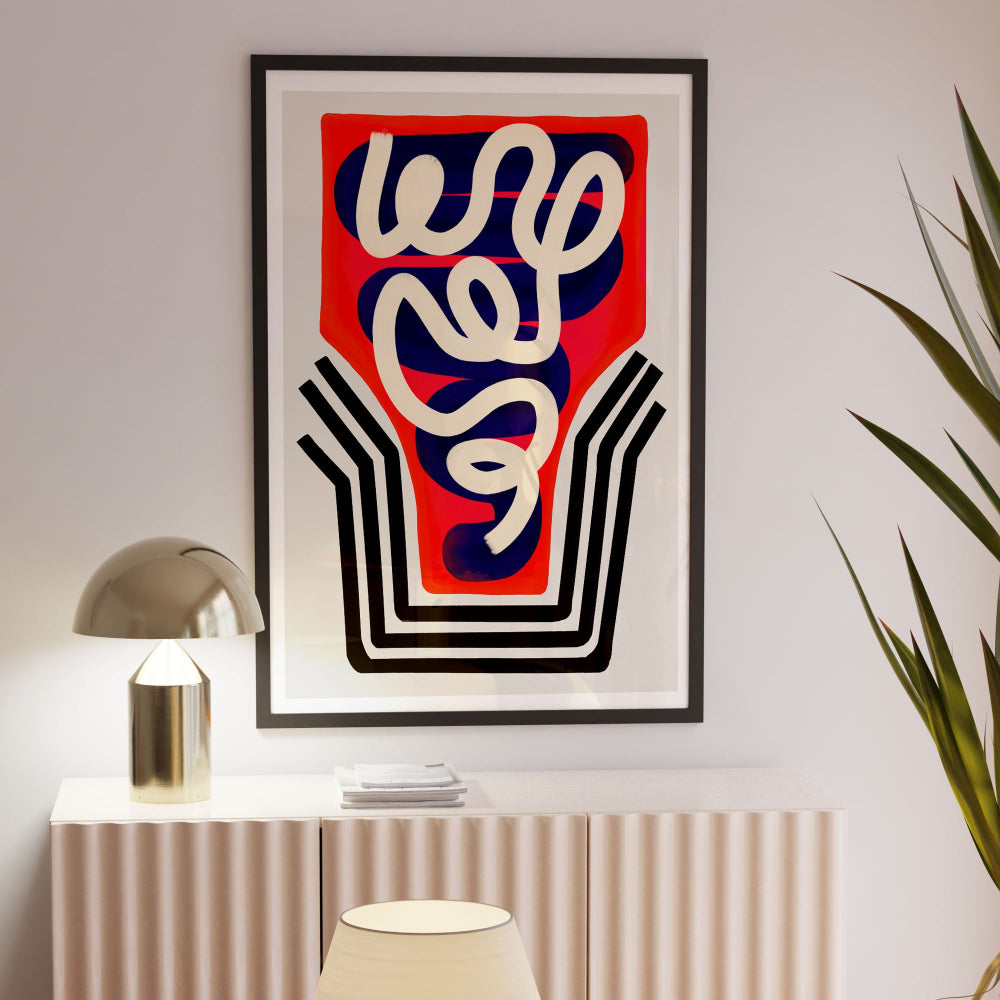 Abstract glass artwork framed above a radiator, styled with a brass lamp and soft plant accents for a curated look.