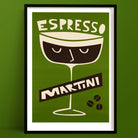 Espresso Martini cocktail art print with a sleepy-eyed glass illustration and coffee beans, framed on a deep olive green wall.