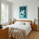 A framed abstract art print with the lettering typography 'FREEDOM' and a white dove illustration hangs above a wooden bed in a bright, modern bedroom.