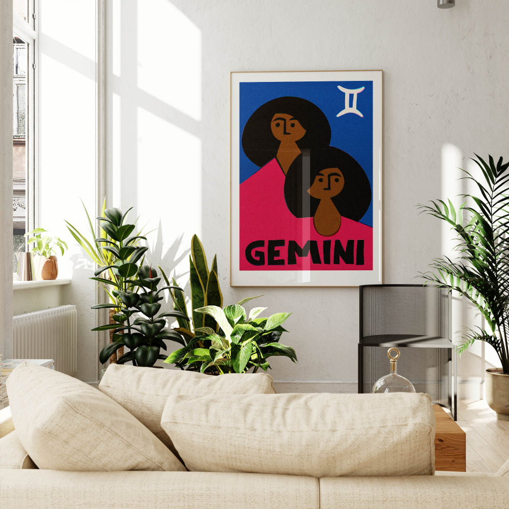 Gemini zodiac poster framed above a cream couch in a bright, plant-filled modern lounge.
