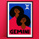 Gemini zodiac art print featuring two stylised twin figures with dark hair on a bold red and blue background, framed on a deep red wall.