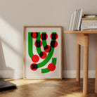 The Green Grass abstract print styled casually on the floor against a minimalist wall, radiating retro energy and a hint of graphic mischief.
