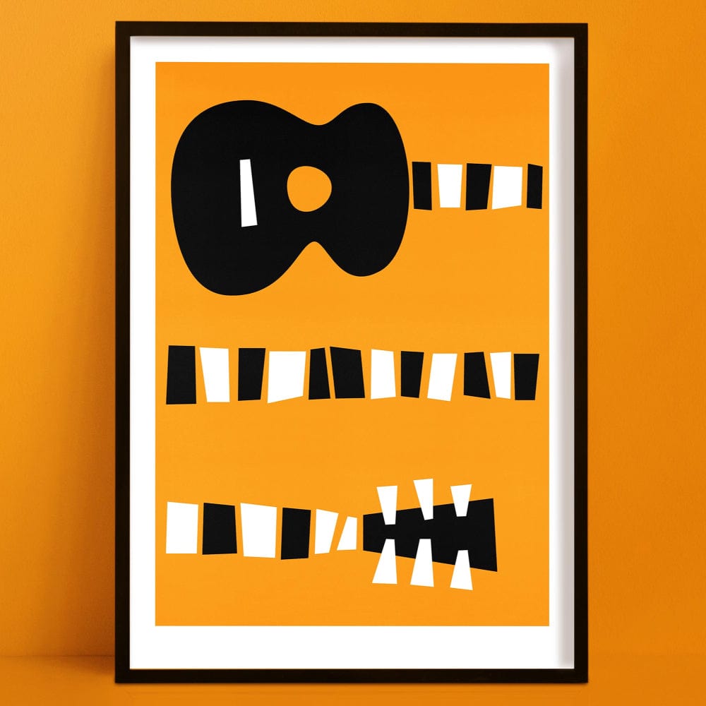Framed abstract guitar print with bold orange background and black-and-white striped accents, displayed on an orange wall