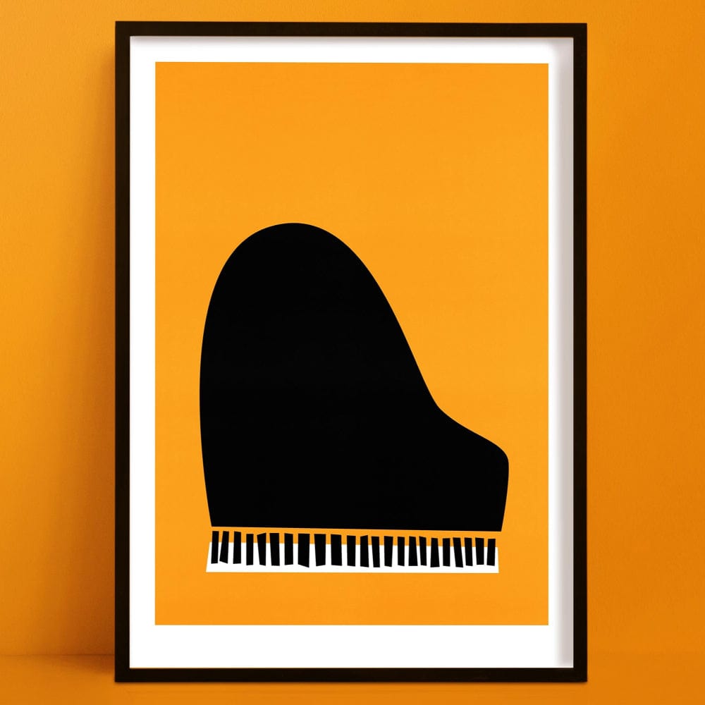 Framed minimalist jazz piano print with bold orange background and black piano shape, displayed on an orange wall