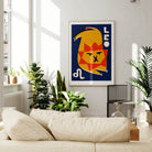 Leo zodiac poster framed above a cream sofa in a bright, plant-filled living space with natural light.