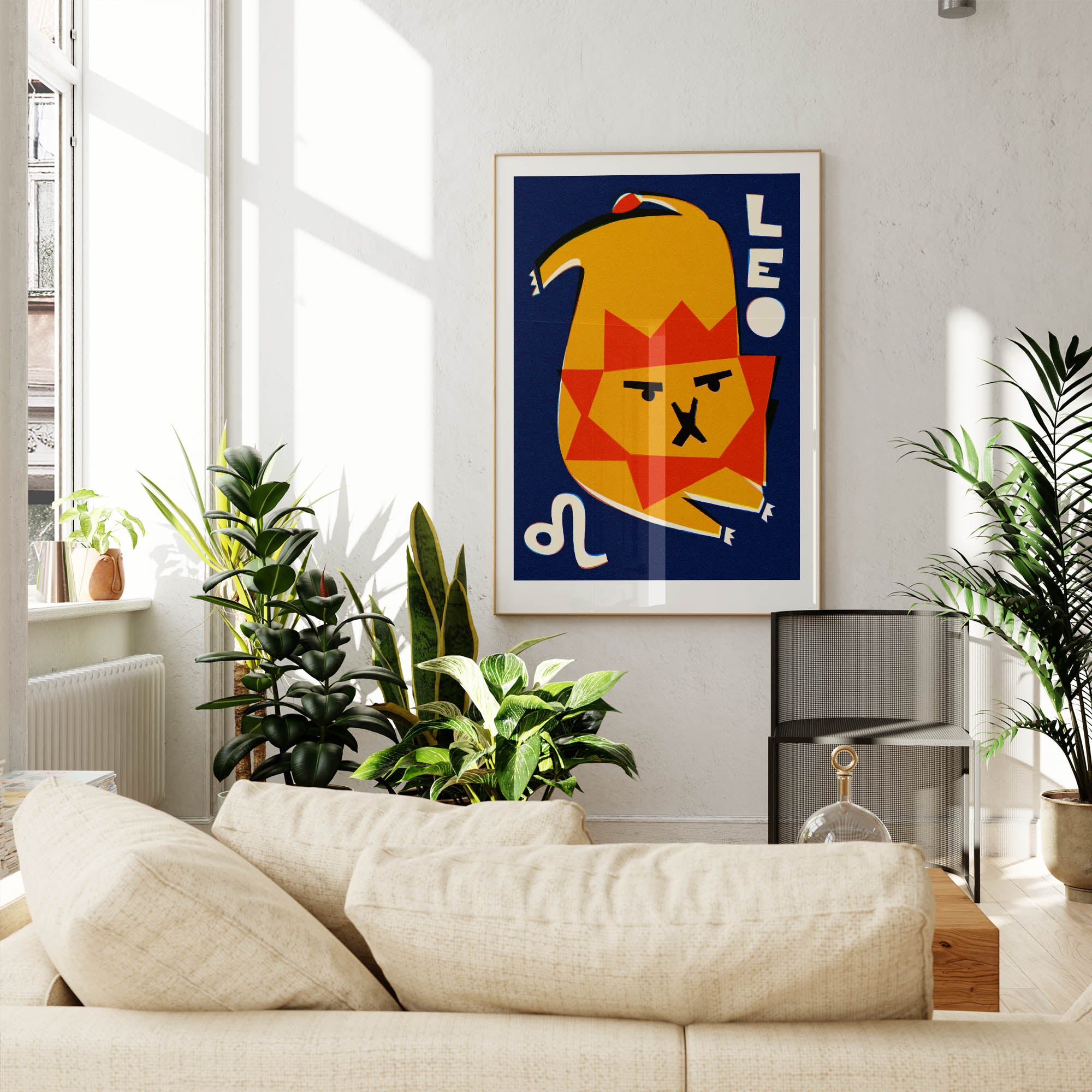 Leo zodiac poster framed above a cream sofa in a bright, plant-filled living space with natural light.