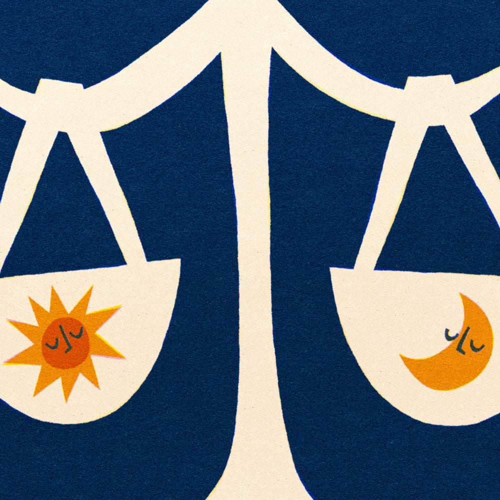 Close-up of the Libra artwork showing sun in one scale and crescent moon in the other with textured blue backdrop.