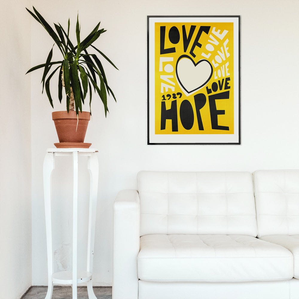 Framed Love & Hope poster adding a burst of positivity to a modern gallery-wall living room