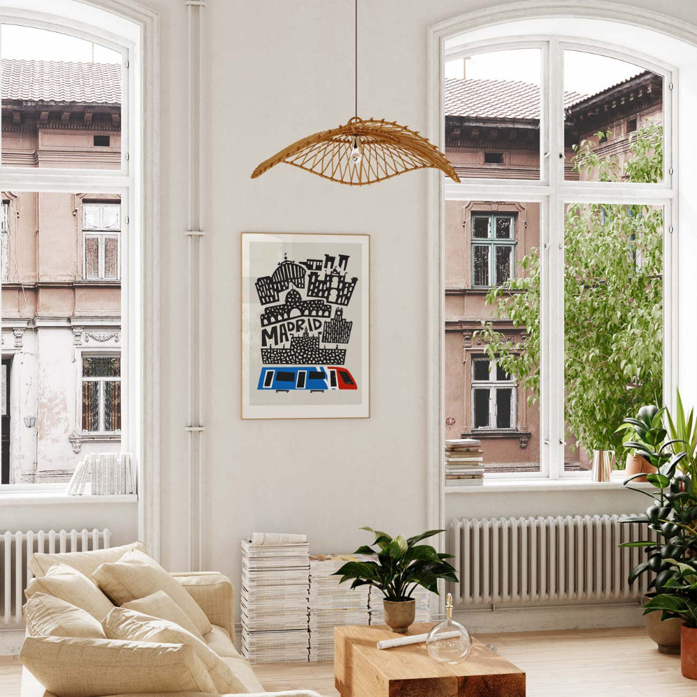 Madrid city poster hanging in a bright room with tall windows, indoor plants and a clean modern aesthetic.
