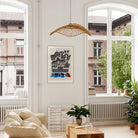 Madrid city poster hanging in a bright room with tall windows, indoor plants and a clean modern aesthetic.