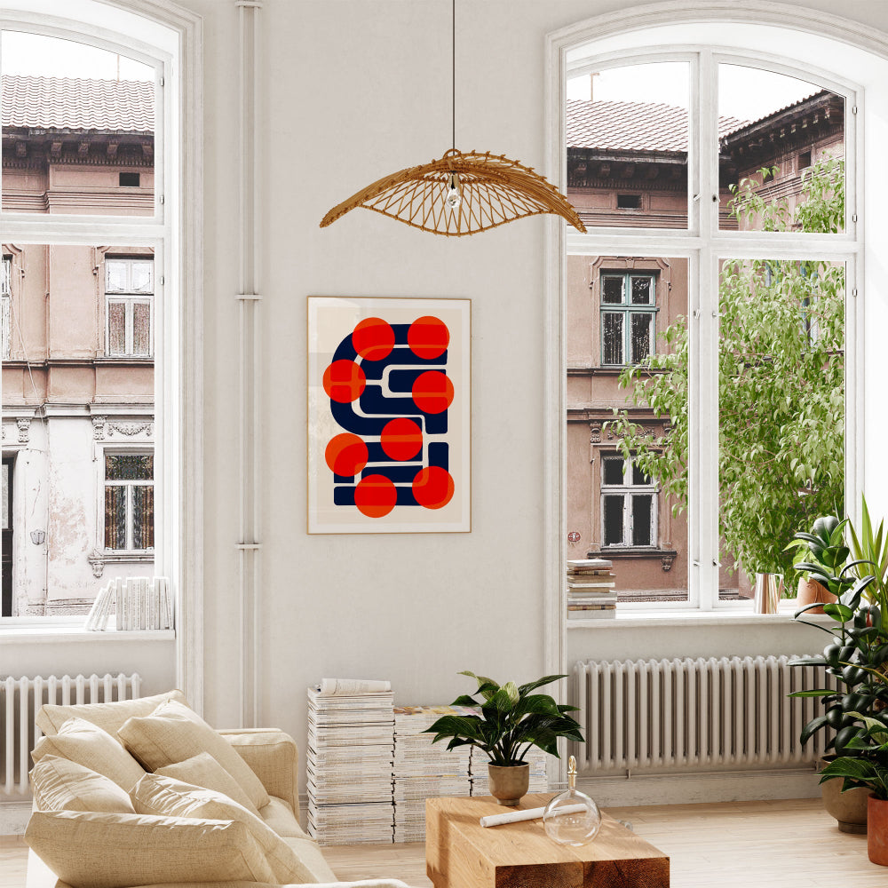 Many Suns hung above a soft-toned sofa, its strong geometric contrasts grounding the space while injecting a vibrant pop-art sensibility into the decor.
