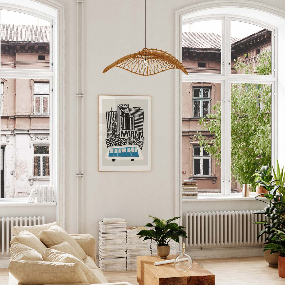 The Miami print displayed in a sunlit interior, where bold urban architecture meets a soothing blue train graphic, evoking the city’s coastal-modern charm.