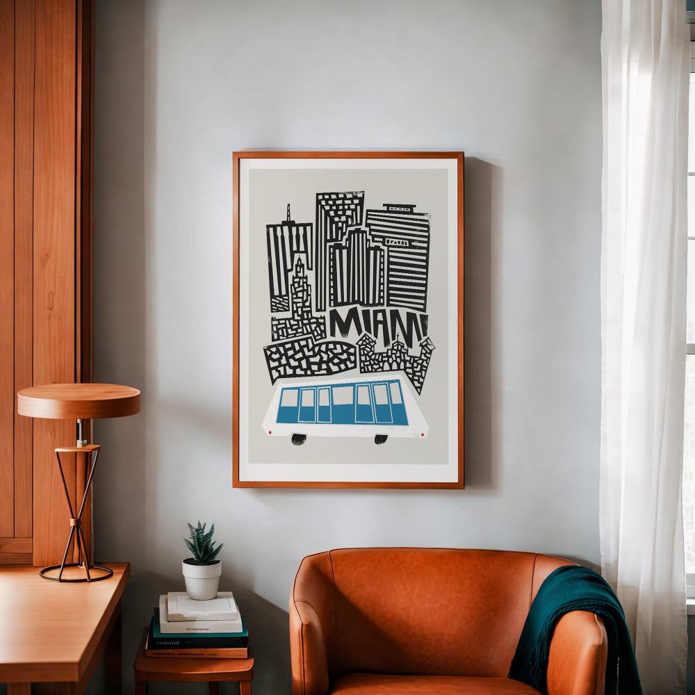 Framed Miami cityscape print on a soft-toned wall, with earthy furniture and decor complementing the vibrant blue train and crisp architectural linework.